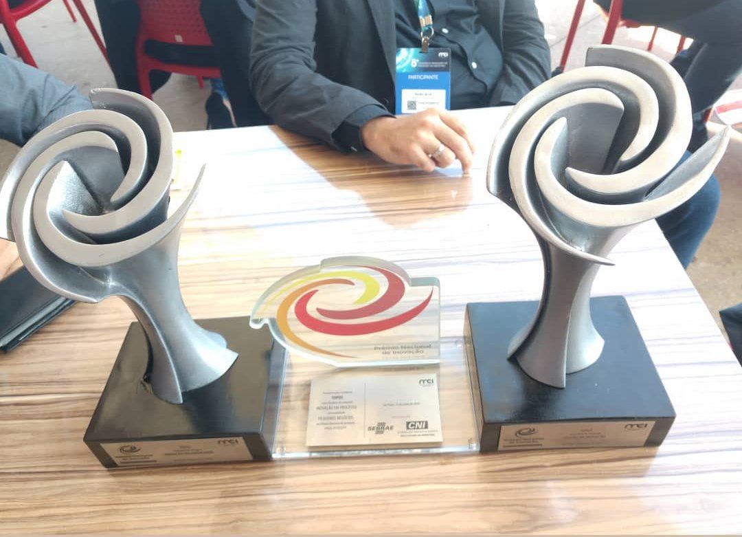 Two National Innovation Award trophies on a table